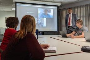 M.Div students and professor in class with students attending virtually over Zoom