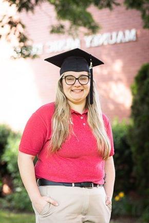 Tiffany Holman stands in front of Mauney Music Building