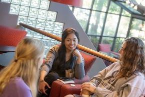 Three older students in conversation at Joe's Coffee