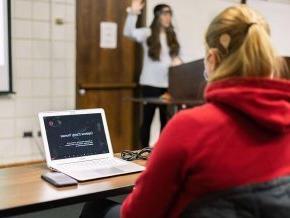 A student utilizes a computer translator.