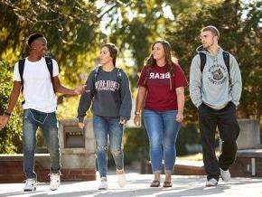 Four LR students walking across campus