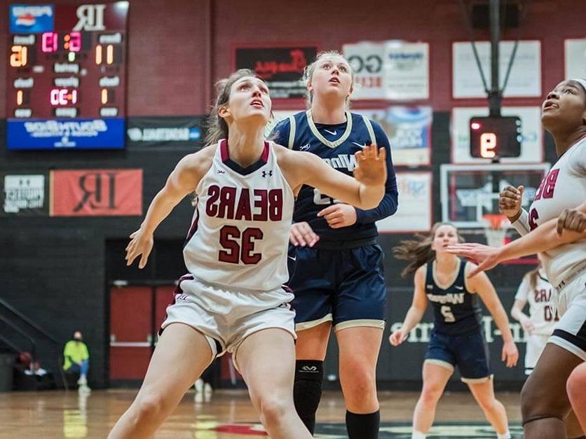 Olivia 纳恩 battling for a rebound on the LR women's basketball team.