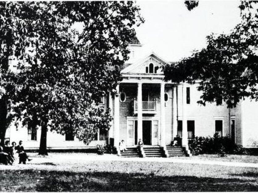 Black and white archive photo of a campus building from early 1900s